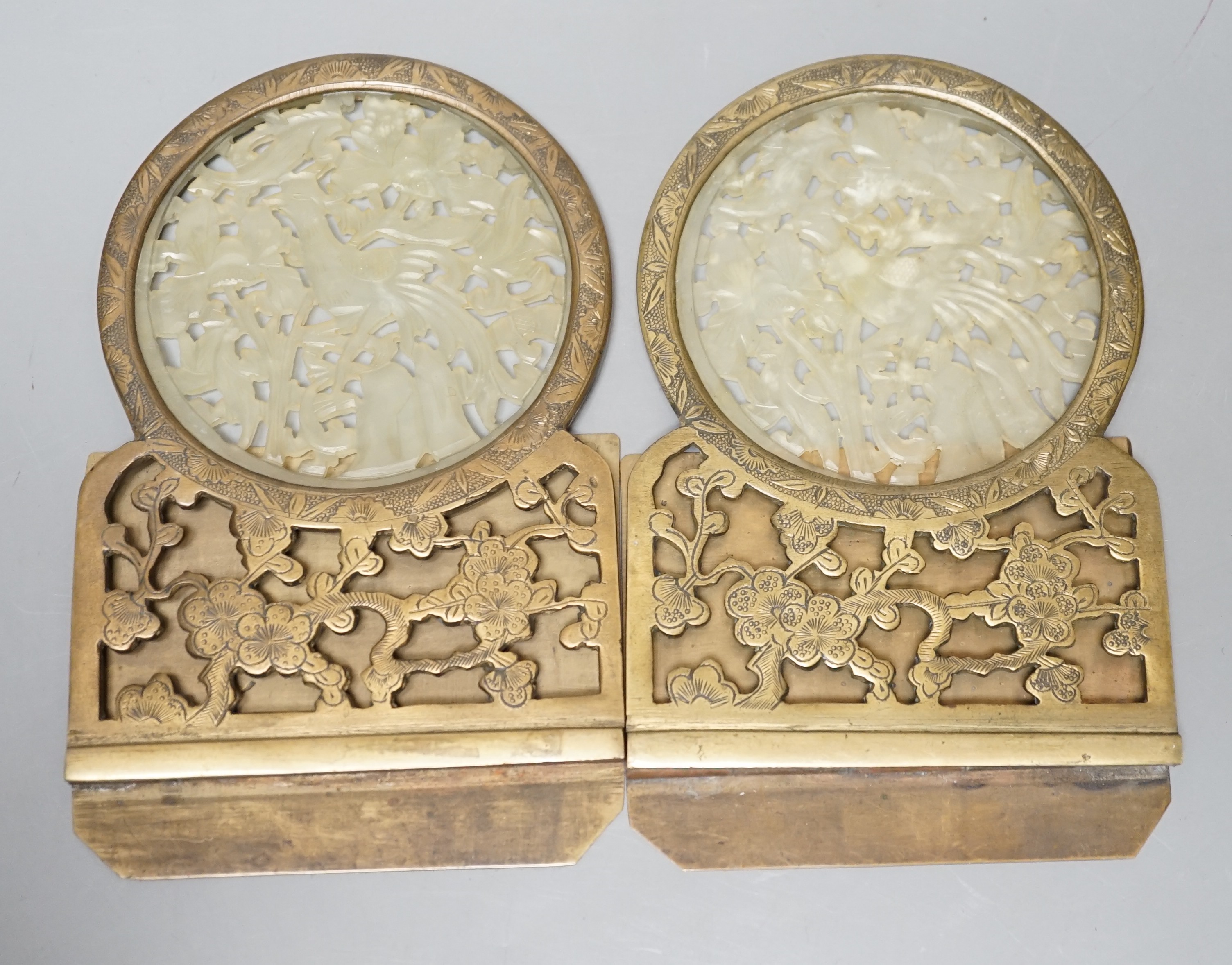 A pair of early 20th century Chinese bowenite jade mounted brass bookends 16cm tall